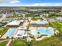 Community pool, clubhouse, and surrounding homes at 2516 Pickett Ave, Saint Cloud, FL 34772