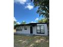 Newly painted ranch home with a modern look and landscaping at 1541 N Hudson St, Orlando, FL 32808