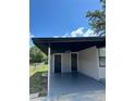Covered carport area with additional storage space at 1541 N Hudson St, Orlando, FL 32808