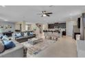 Open living space featuring a comfortable seating area and kitchen views at 1770 Sawyer Palm Pl, Kissimmee, FL 34747