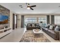 Spacious living room with large windows, sliding glass doors, and comfortable seating at 1770 Sawyer Palm Pl, Kissimmee, FL 34747