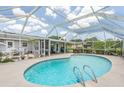 Screened patio with refreshing pool at 720 Shore Drive, Kissimmee, FL 34744