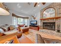 Living room with leather furniture, brick fireplace, and hardwood floors at 4450 Kaiser Ave, St Cloud, FL 34772
