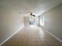 Bright living room featuring tile floors and large windows at 3180 Owassa Ct, Kissimmee, FL 34746
