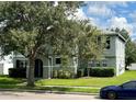 Two-story house with gray siding, black shutters, and a landscaped lawn at 2039 Florida Soapberry Blvd, Orlando, FL 32828