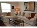 Spacious living room with sectional sofa and coffee table at 3208 Cupid Pl, Kissimmee, FL 34747