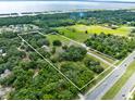 Large lot with home and highway frontage at 950 S Narcoossee Rd, St Cloud, FL 34771