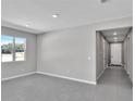 Bright living room with tile floors and hallway access at 4063 Bannock Ave, Tavares, FL 32778