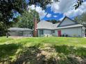 House backyard with screened in pool at 2086 Camelot Blvd, St Cloud, FL 34772