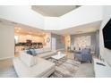 Open living room with a large sectional sofa and high ceilings at 2744 Bookmark Dr, Kissimmee, FL 34746