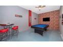Game room with a pool table and bar-height seating at 2744 Bookmark Dr, Kissimmee, FL 34746