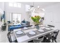 Bright dining area with a large table and seating for eight at 3028 Protagonist St, Kissimmee, FL 34746