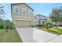 Two-story home with a two car garage at 3920 Saltmarsh Loop, Sanford, FL 32773