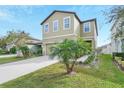 Two-story home with a two car garage at 3920 Saltmarsh Loop, Sanford, FL 32773