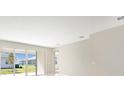 Bright living room with sliding glass doors leading to the backyard at 4252 Sawtooth Ct, Tavares, FL 32778