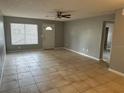 Living room with tile floors and neutral gray walls at 725 Northlake Blvd # 52, Altamonte Springs, FL 32701