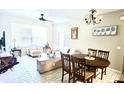 Bright living room with comfortable seating and a dining area at 6335 Contessa Dr # 205, Orlando, FL 32829