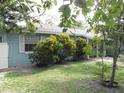Front view of a light blue house with mature landscaping at 1632 N Fullers Cross Rd, Winter Garden, FL 34787
