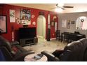 Living room features a large TV and comfortable seating at 624 Gull Dr, Poinciana, FL 34759