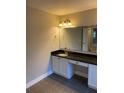 Bathroom boasts a vanity with granite countertop at 11460 Chateaubriand Ave, Orlando, FL 32836