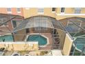 Enclosed pool area with patio furniture, providing a private oasis at 8545 Bay Lilly Loop, Kissimmee, FL 34747