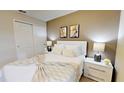 Bright bedroom with double bed and neutral color scheme at 5144 Adelaide Dr, Kissimmee, FL 34746
