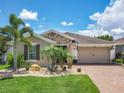 Attractive one-story home with stone accents and landscaped yard at 672 San Joaquin Rd, Kissimmee, FL 34759