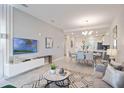 Open concept living and dining area with modern decor at 3171 Paradox Cir # 403, Kissimmee, FL 34746