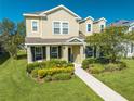 Two story house with landscaping and walkway at 2662 Trafalgar Blvd, Kissimmee, FL 34758