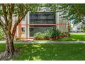 Condo building exterior with lush landscaping at 1130 N Lake Parker Ave # C129, Lakeland, FL 33805
