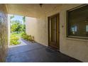 Exterior view of condo building with pathway and green space at 1130 N Lake Parker Ave # C129, Lakeland, FL 33805