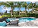 Private pool and spa with lounge chairs and lush landscaping at 200 Pendant Ct, Kissimmee, FL 34747