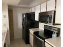 Kitchen with stainless steel appliances and tile floor at 2022 Royal Bay Blvd # 93, Kissimmee, FL 34746