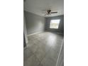 Bright bedroom with tile flooring and ceiling fan at 9817 Turf Way # 8, Orlando, FL 32837