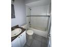 Clean bathroom with tub shower and granite vanity at 9817 Turf Way # 8, Orlando, FL 32837