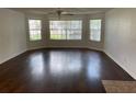 Bright living room featuring hardwood floors and large windows at 2717 N Poinciana Blvd # 179, Kissimmee, FL 34746