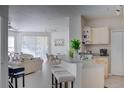 Open kitchen with breakfast bar and living room views at 1100 Lake Shadow Cir # 2101, Maitland, FL 32751