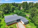 Aerial view of a gray house with a carport at 2540 Prine Rd, Lakeland, FL 33810