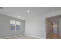 Bright and airy living room with tile floors and access to the hallway at 2035 Stetson Ct, Eagle Lake, FL 33839