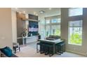 Community room with TV, seating area, and bar at 7740 Sandy Ridge Dr # 226, Kissimmee, FL 34747