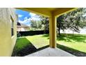 Covered patio overlooking a grassy backyard at 14642 Yellow Butterfly Rd, Windermere, FL 34786