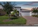 Stunning curb appeal with a brick driveway at 742 San Joaquin Rd, Poinciana, FL 34759