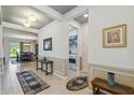 Elegant entryway with tile flooring and views of dining and laundry areas at 742 San Joaquin Rd, Poinciana, FL 34759