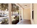 Covered front porch with white columns and view of street at 1686 Prospect Ave, Orlando, FL 32814