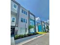 Modern townhome community with teal and white exteriors at 7760 Sandy Ridge Dr # 214, Kissimmee, FL 34747