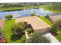 Single-Gathering home with a tile roof, situated by a lake at 154 Rancho Mirage Dr, Kissimmee, FL 34759