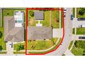 An aerial view showcasing the home's lot, including the house, backyard, and surrounding neighborhood at 5051 Plymouth Turtle Cir, St Cloud, FL 34772