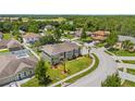 Two-story house situated in a residential neighborhood with a golf course nearby at 5051 Plymouth Turtle Cir, St Cloud, FL 34772