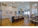 Modern kitchen boasts white cabinetry, large island, and breakfast nook at 4962 Lazy Oaks Way, St Cloud, FL 34771
