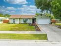 Light green house with two car garage at 961 Whisler Ct, St Cloud, FL 34769